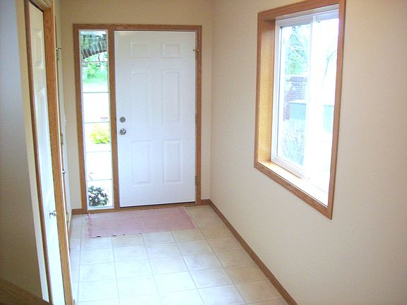 Foyer with Coat Closet and Door to Garage (Now UPDATED with Luxury Vinyl Plank Floors)