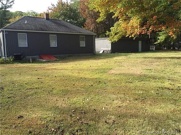 Level backyard with oversized garage.