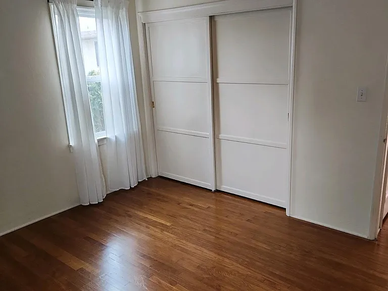 Gorgeous floors, bedroom closet, new paint, curtains