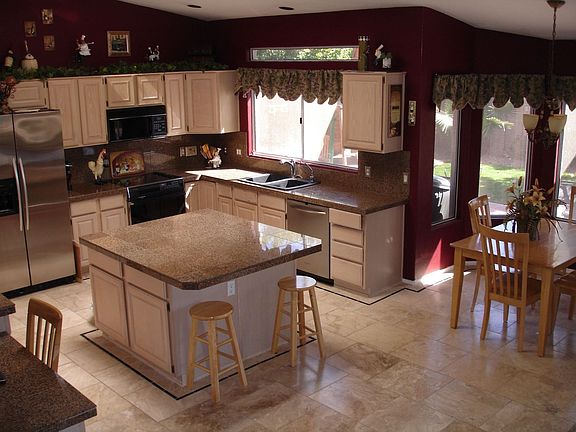 Granite tile,stainless steel appli, r/o sys, pull outs,skylights