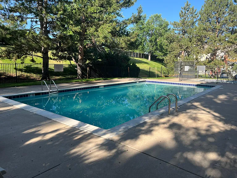 Community pool with adjacent kiddie pool.