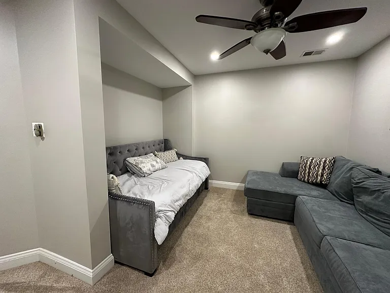 Second floor contains two guest bedrooms, den, one full bathroom,