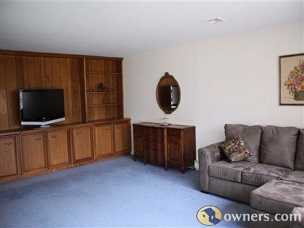 Living Room with Custom Built In MahoganyBook Cases and Cabinets