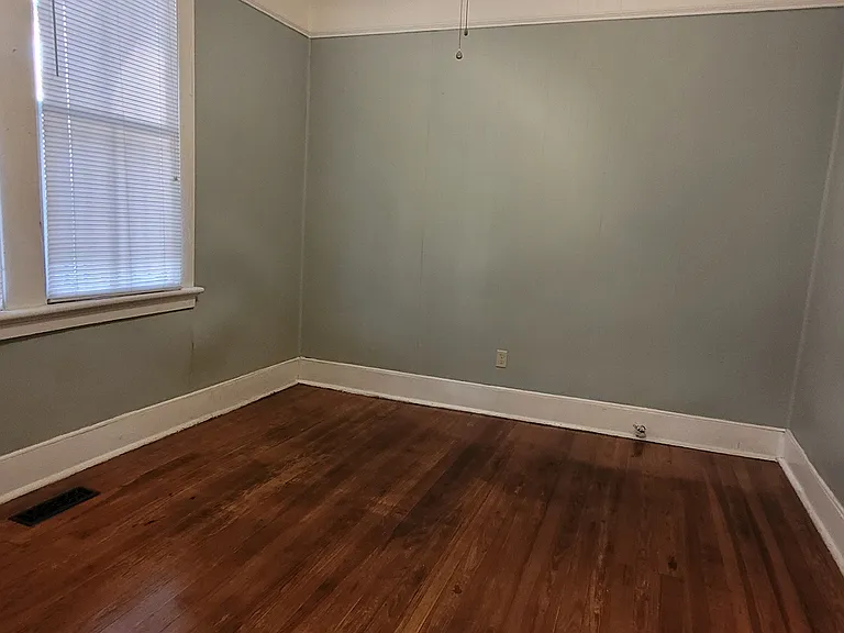 This large room with closet, adjacent to the kitchen, can be utilized as the Living room or as a large bedroom.
