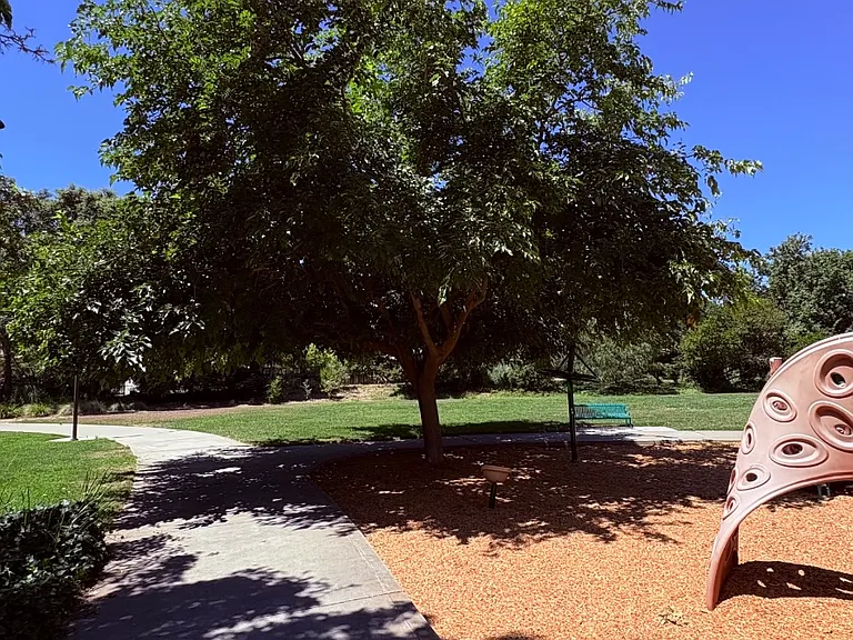 Shaded playground and outdoor recreation nearby