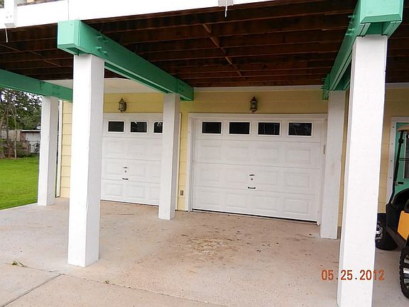 Three car garage plus carports