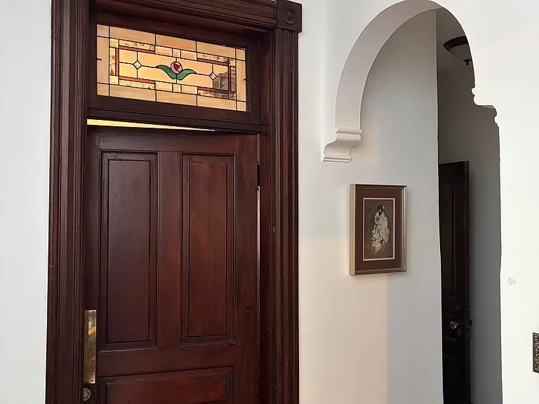Second floor landing archway showing door to guest bedroom