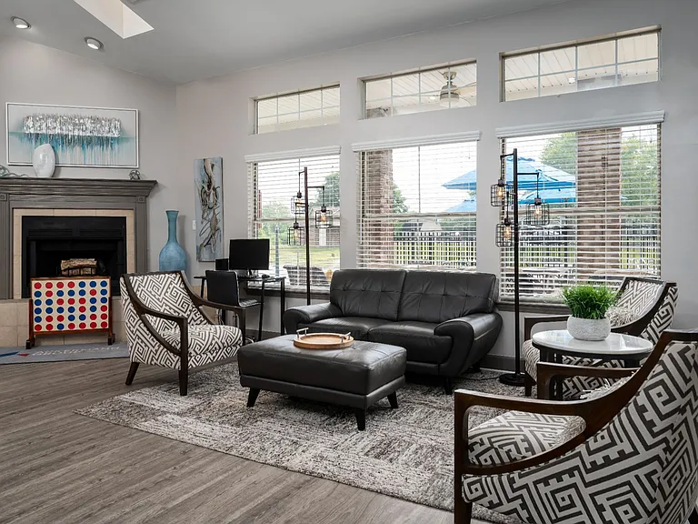 Step into a spacious living area at Windridge, filled with natural light and designed for comfort, relaxation, and gatherings.