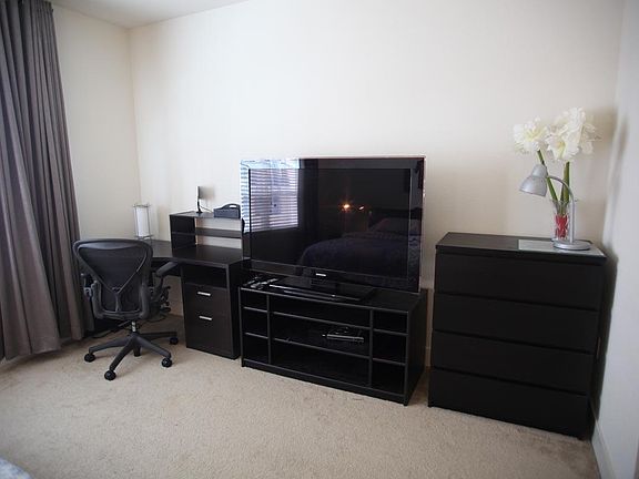 55" TV and work desk w/ Herman Miller Chair