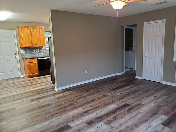 OPEN FLOOR PLAN LEADS TO FENCED IN DECK AND PRIVATE ENTRANCE TO AND FROM PARKING.