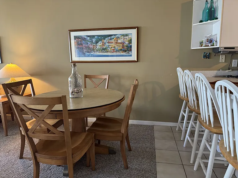 Dining table and eat-up kitchen bar for a quick bite.