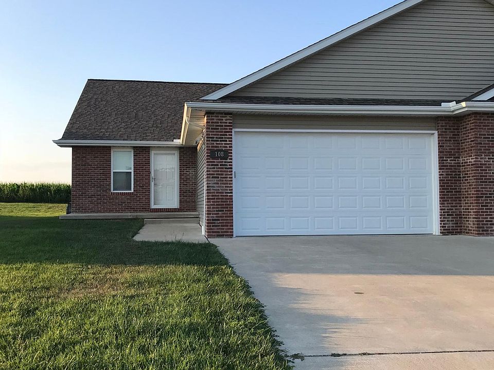 Duplex front door separated by garage.