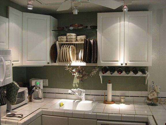 Fully Stocked Kitchen, fridge with ice maker, stove, dishwasher, microwave.