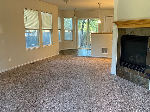Living Room with a propane fireplace located on the main floor