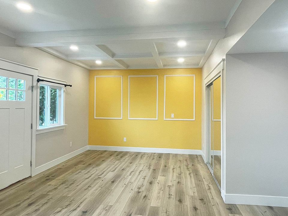 Plenty of light with recessed lights and windows. Details: Wood beam and wood trim decor