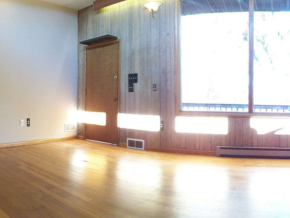 A wall of windows allows views of the large private deck and grounds.