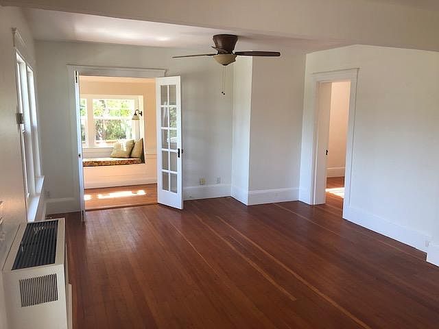 Living Room, with original hardwood floors.