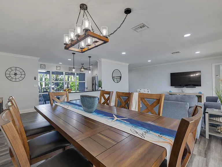 Large dining table with seating for 8.