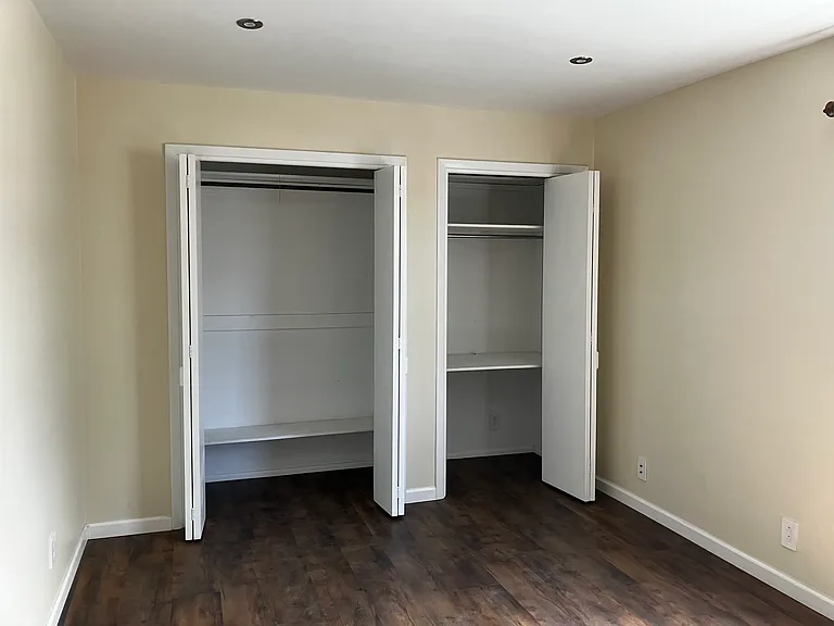 Master bedroom with 2x double door closets
