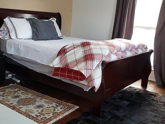 Master Bedroom with winter linens and Horsehair rug and imported Turkish rug.