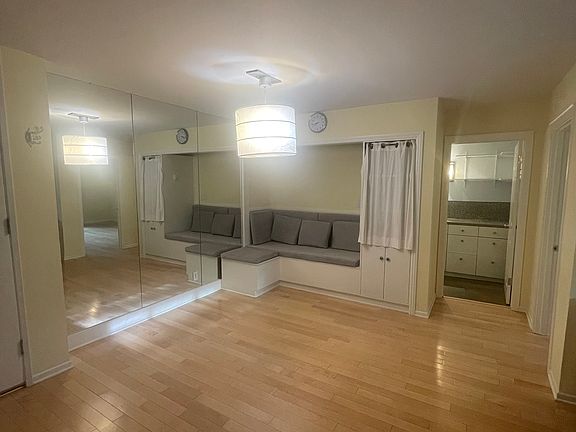Dining area with cushioned bench that lifts up for extra storage