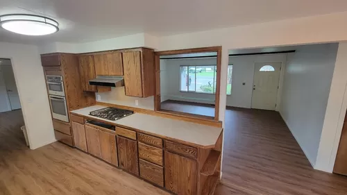 see living from dining room area with pass through in kitchen - 7303 102nd St E