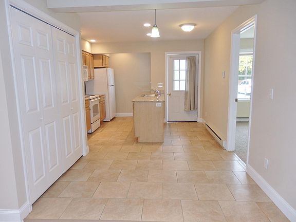 Dining room looking in to the kitchen, laundry closet is on left side