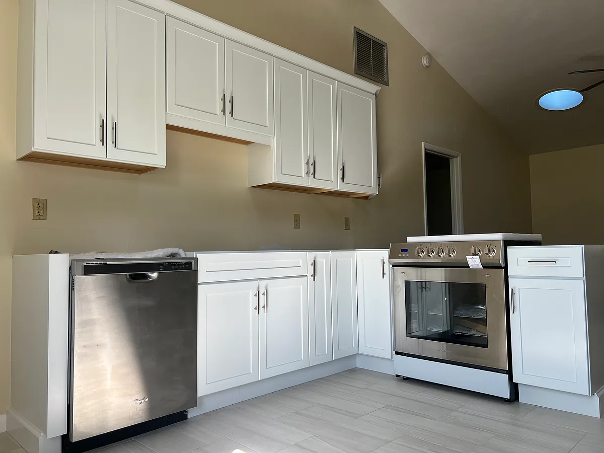 A total of 19 custom cabinets adorn this updated kitchen. - 4562 Barnacle Dr