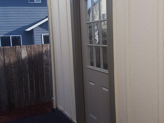 Storage Shed Entrance Behind Fenced Area