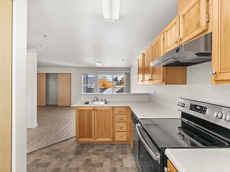 Bright kitchen with modern appliances and open layout. Bright kitchen with modern appliances and open layout.