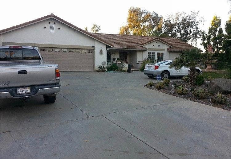 Exterior of home with large driveway