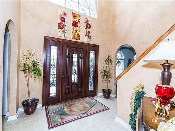 Elegant 2 story soaring entry with newer entry doors.