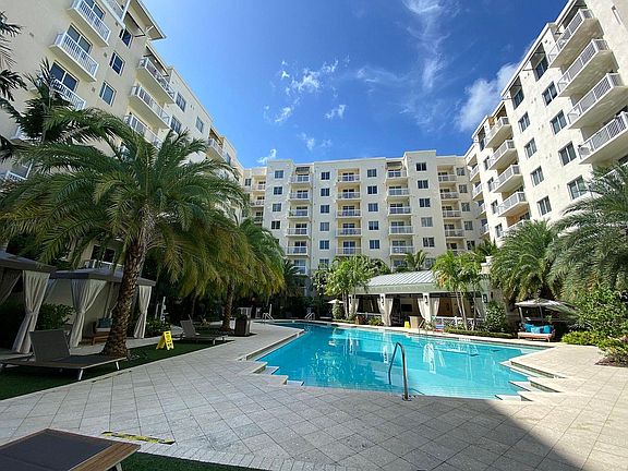 Resort-Style Swimming Pool with Luxury Cabanas