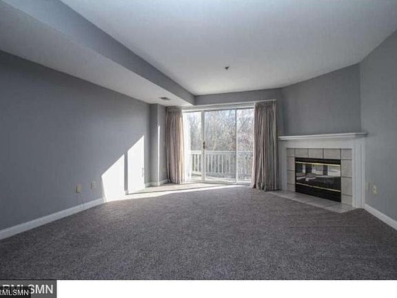 Living room with fire place and balcony