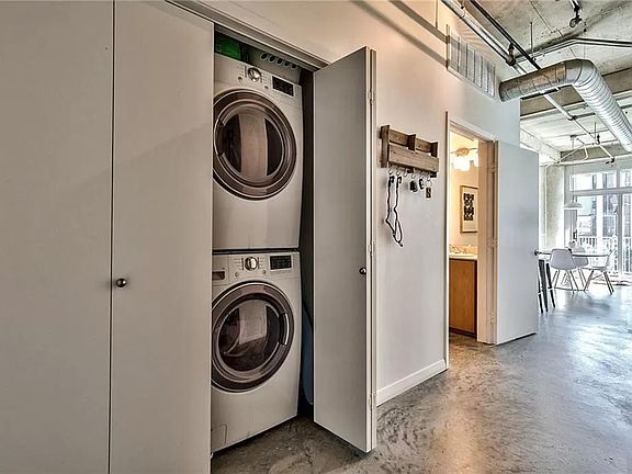 Entryway with washer and dryer visible