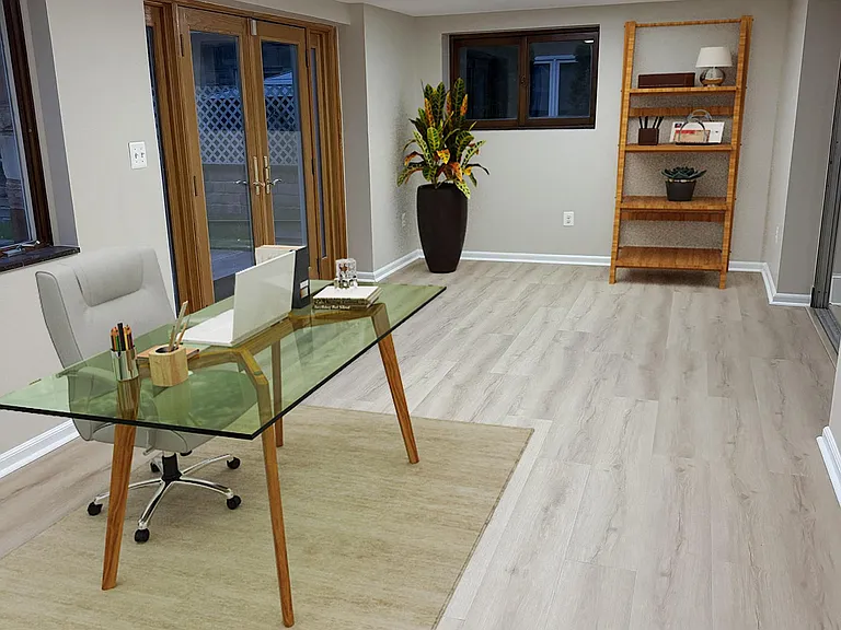 Lower-level office area with French door access to patio and yard.