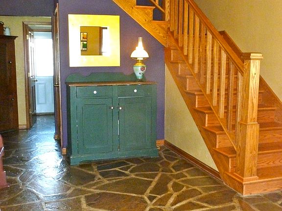 Flagstone floors + oak stair