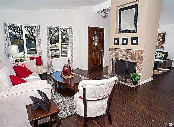 The light and spacious floor plan features the living room in th