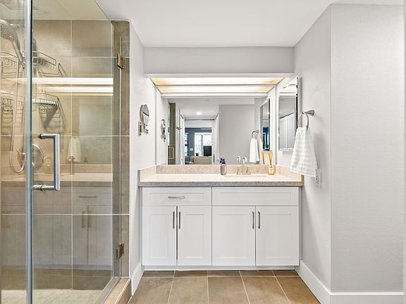 bathroom with walk in shower and glass shower door