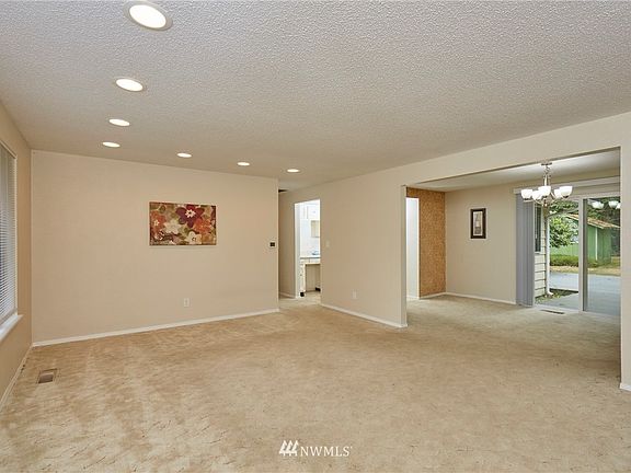 Another View Of Living Room To Dining Room With Slider to Backyard