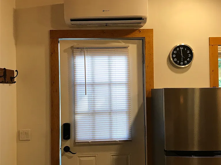 Front door with mini split AC/Heater above. Controlled with remote provided.