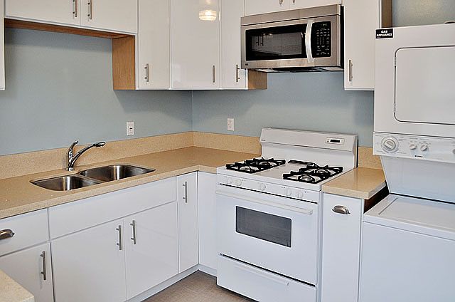 Kitchen with washer and dryer