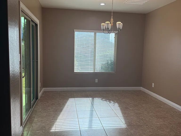 dining room with sliding doors to covered patio
