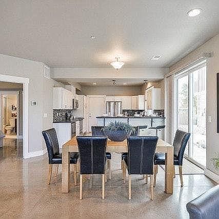 Open plan living, dining, kitchen with access to master suite