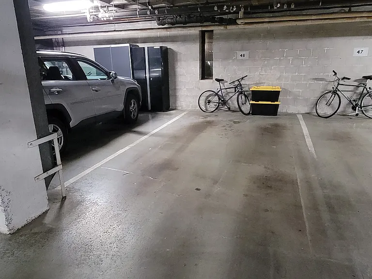 Reserved parking spot with bike security hookup