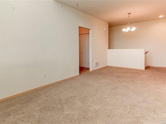 View from LR to top of stairs; behind bi-fold doors is laundry area