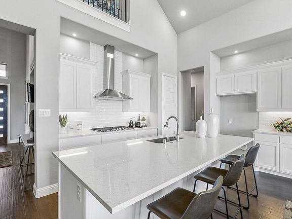 Kitchen in the Keats home plan by Trophy Signature Homes - REPRESENTATIVE PHOTO