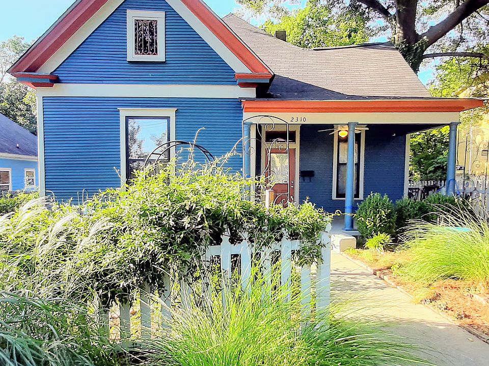 Richly landscaped charming shared front yard.