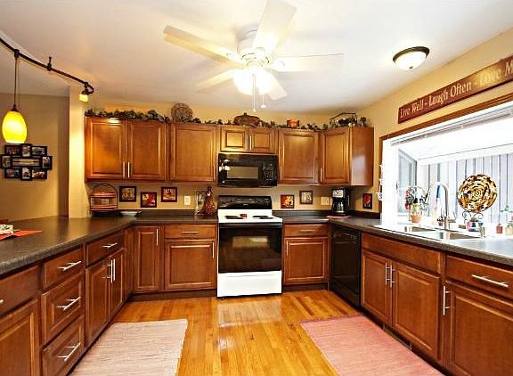 Fully remodeled kitchen with newer appliances, counter tops, cabinets, ceiling, hardwood floors and dont forget the shadow box window!