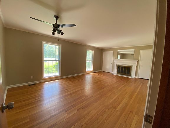 Living room with coat closet & NON working fireplace